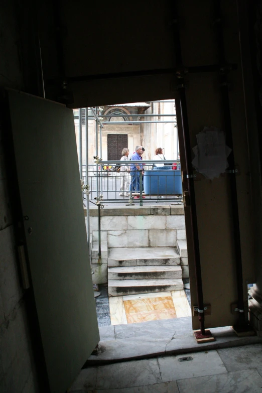 the entrance to a public building with people waiting