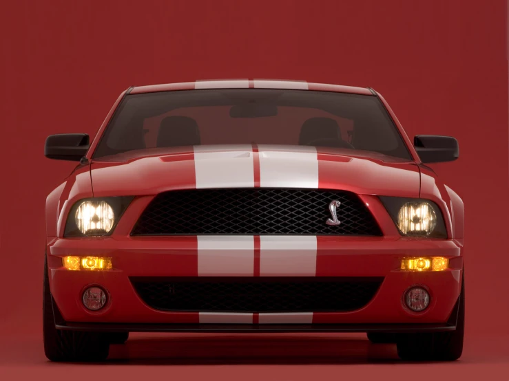 an image of a red and white mustang