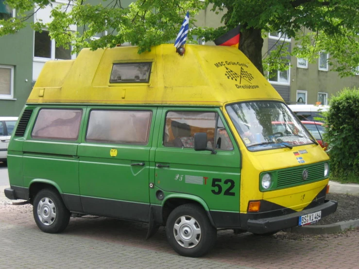 a van parked near a street in front of buildings