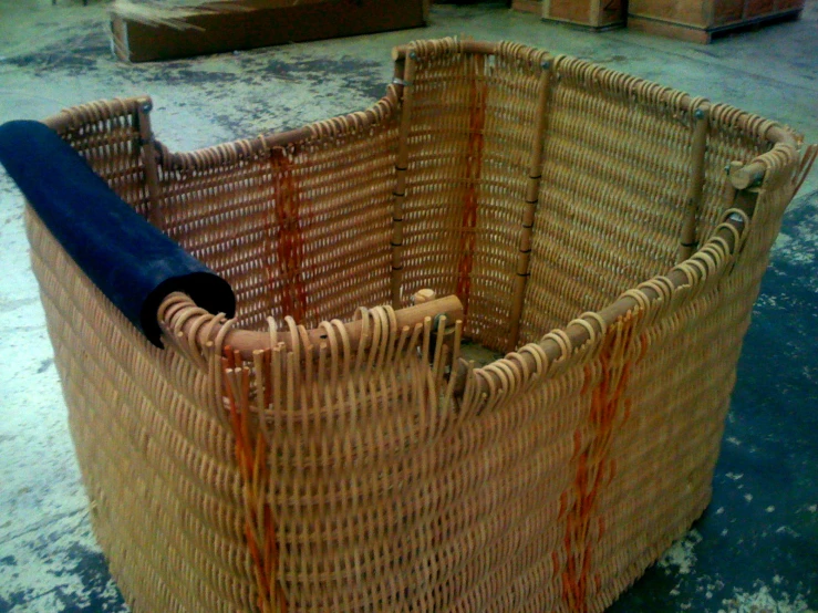 a rattan chair is being repaired and has  dripping