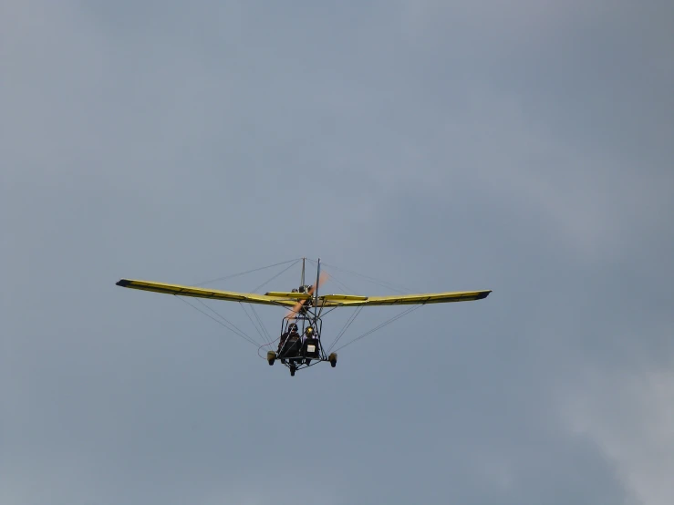 someone is performing an aerial trick on the glider