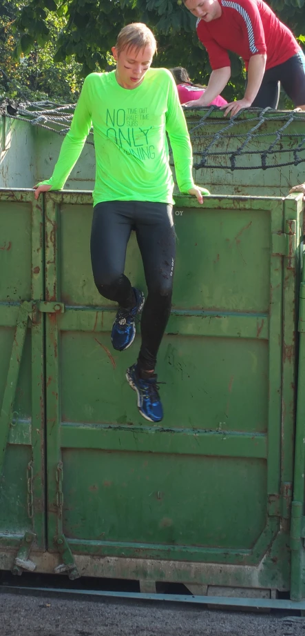 an image of a man in front of a dumpster that is running