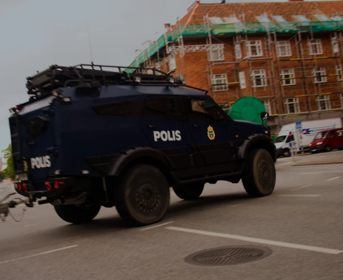 a police vehicle with a person walking by