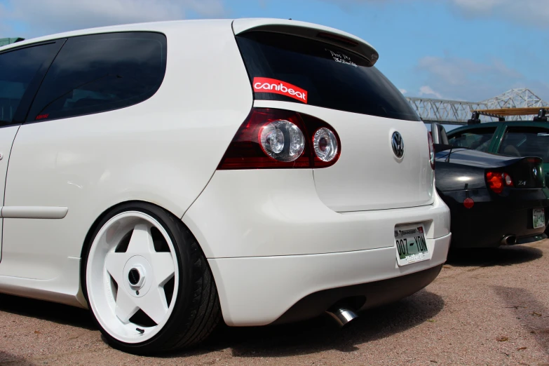 an image of white volkswagen on the parking lot