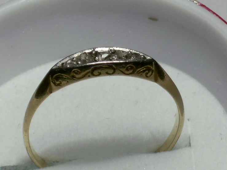 a ring sitting on top of white cloth
