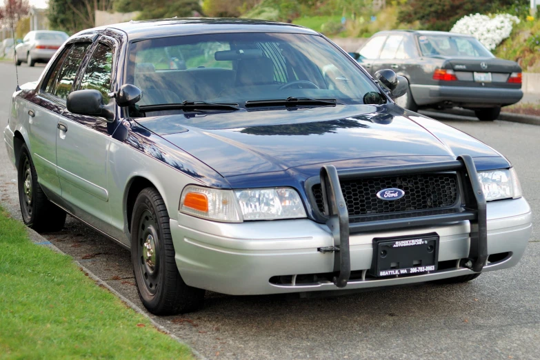 a ford crown victoria in a residential street