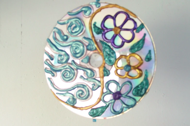 a colorful plate is hanging on the wall