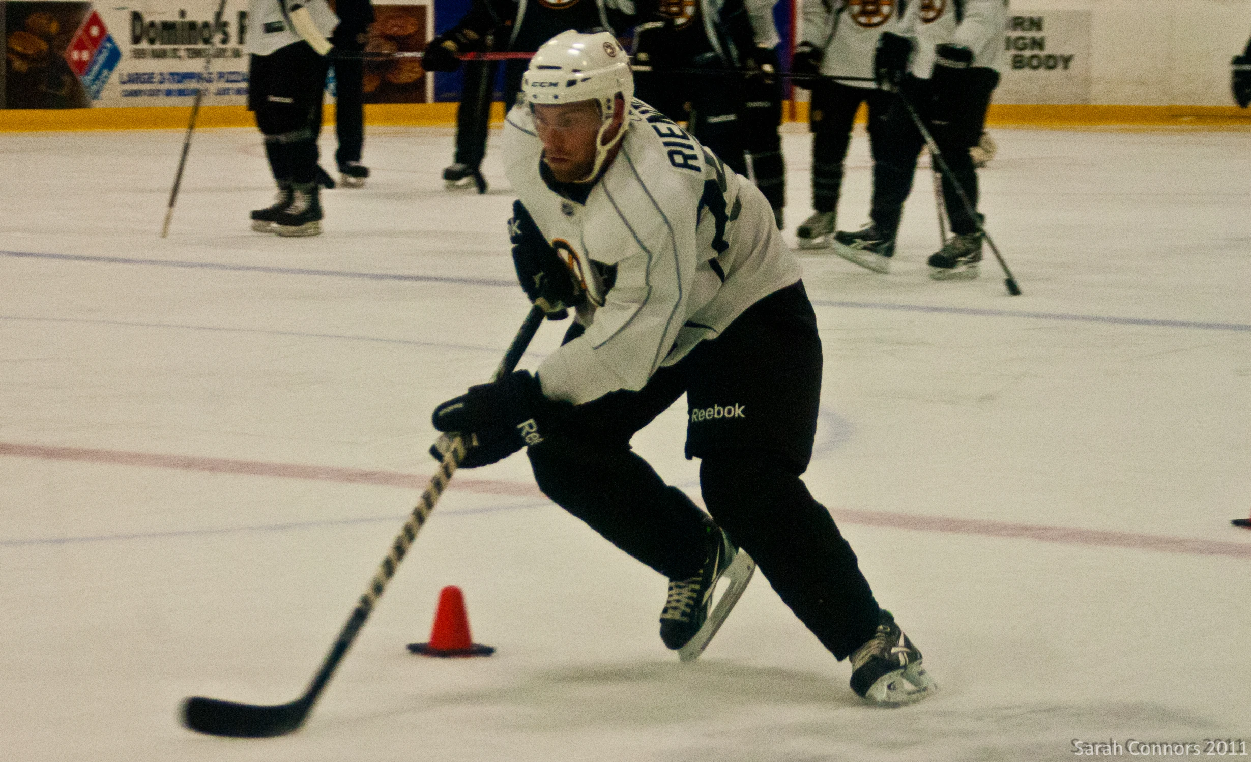 the hockey player is moving through the ice