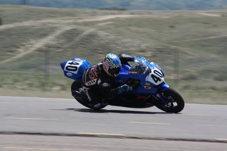 person on a motorcycle in a race on the road