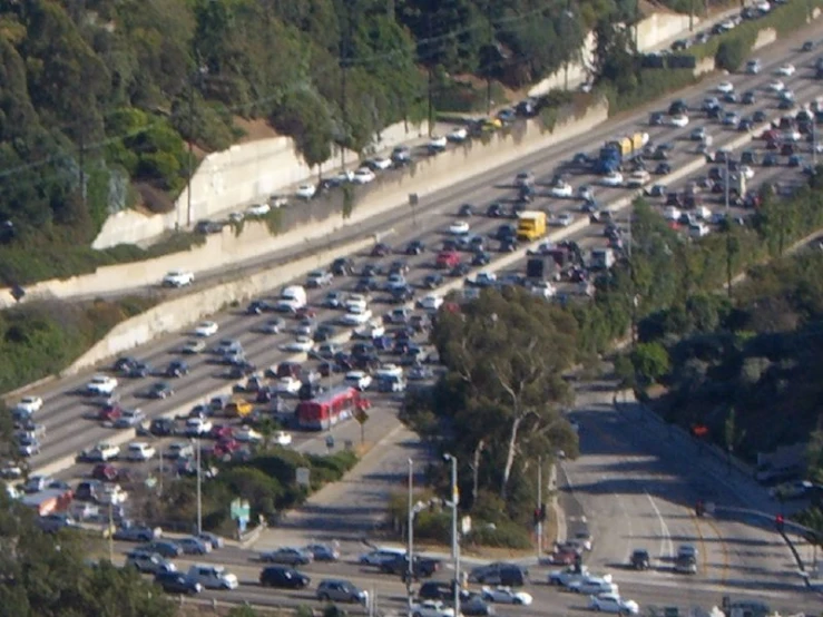 many cars are parked on the side of the road