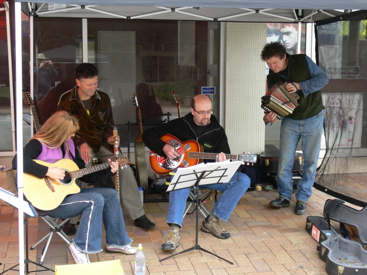 the musicians are playing some music on the stage