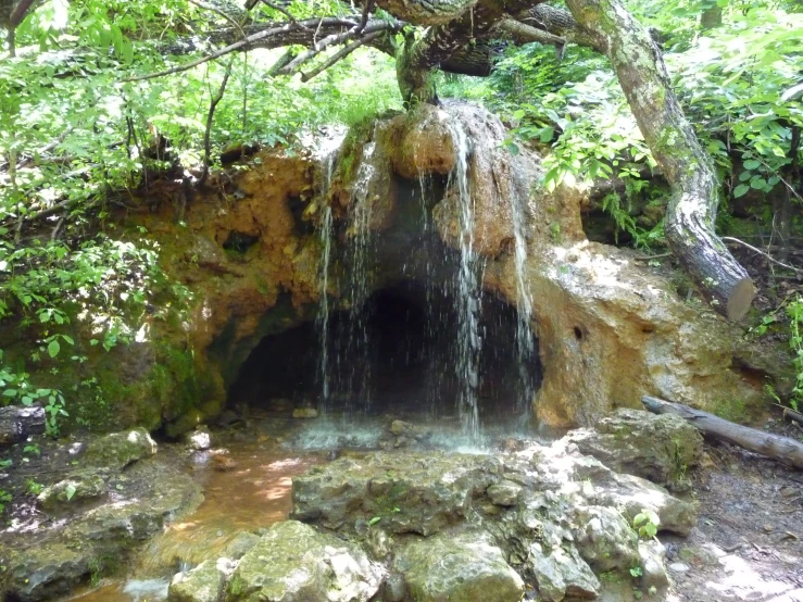 this is an image of a waterfall with water coming out