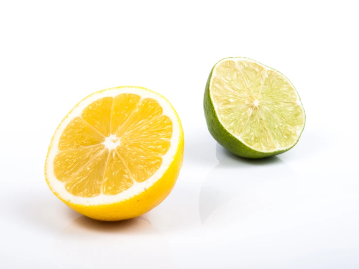 a lemon, lime slice and half a lime