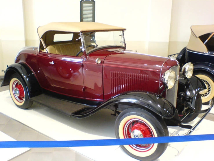 an antique car on display at the museum