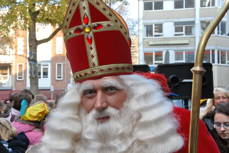 a man in a red and gold costume