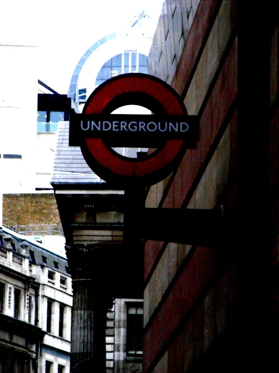 a close up of a red sign on a building