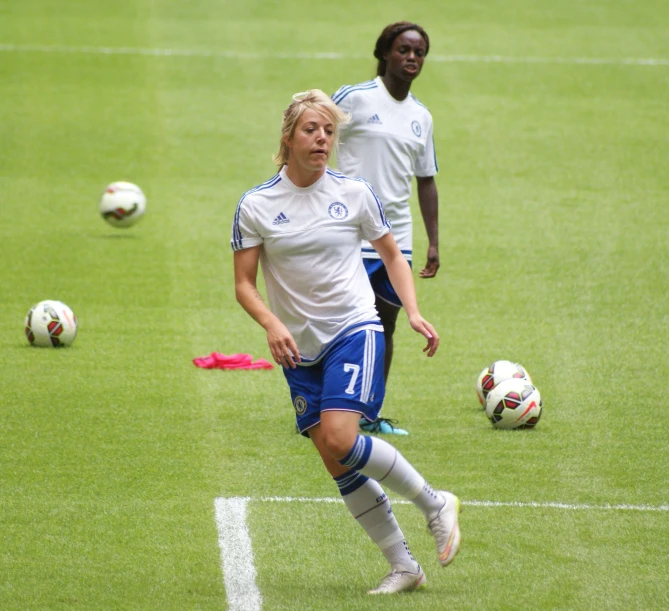 a man and a woman playing soccer on the field