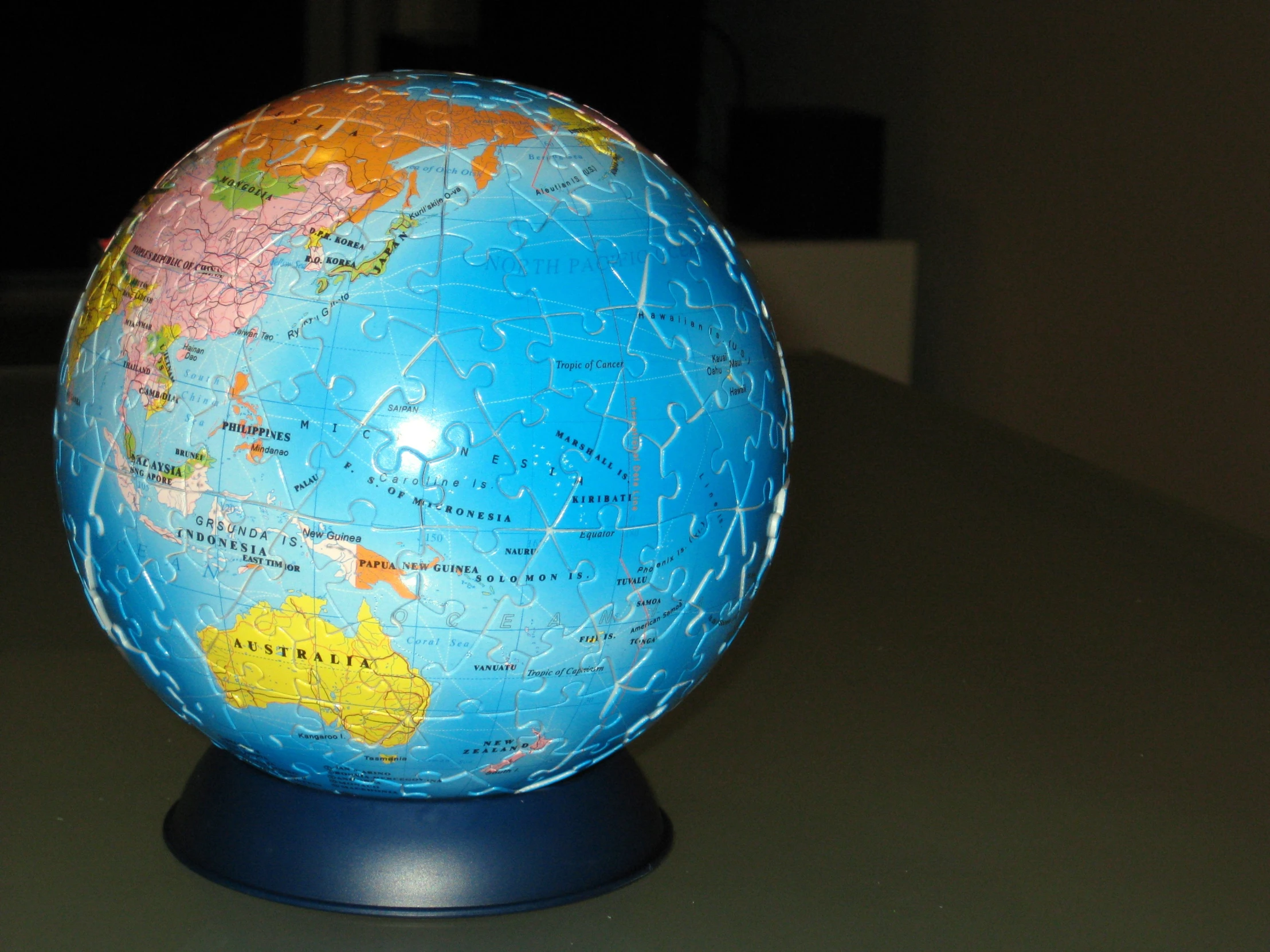 a globe sits on top of a desk with no people