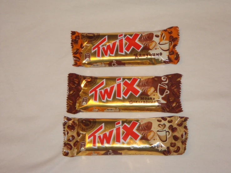 three small bars with candy on top of them