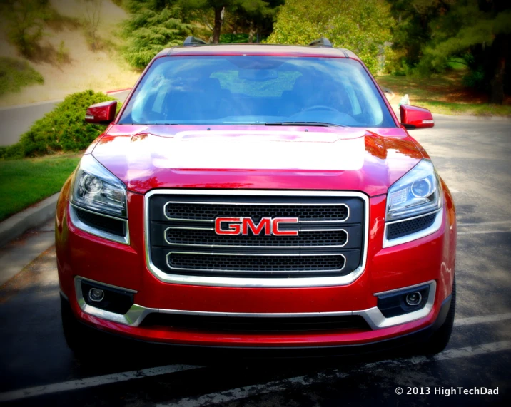 a red car that is sitting in the parking lot