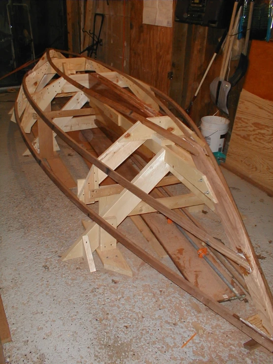 a boat being made by hand and used in a shop