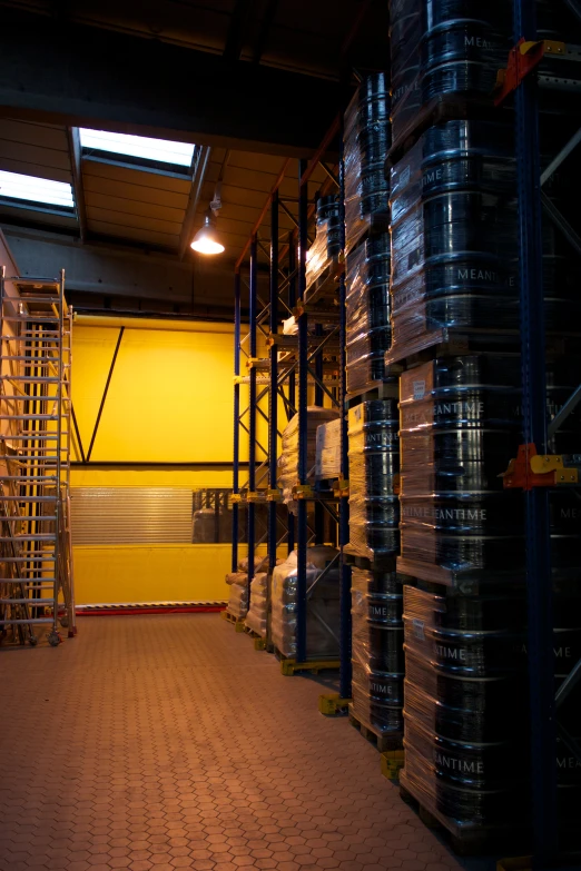 a yellow building with metal and concrete shelving