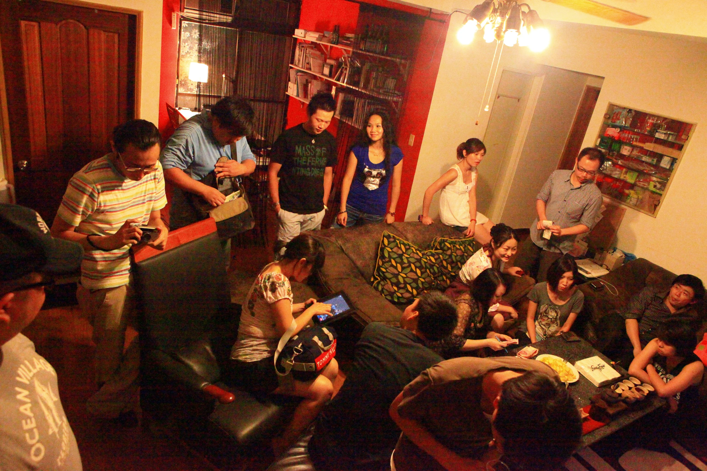 many people are gathered inside a living room