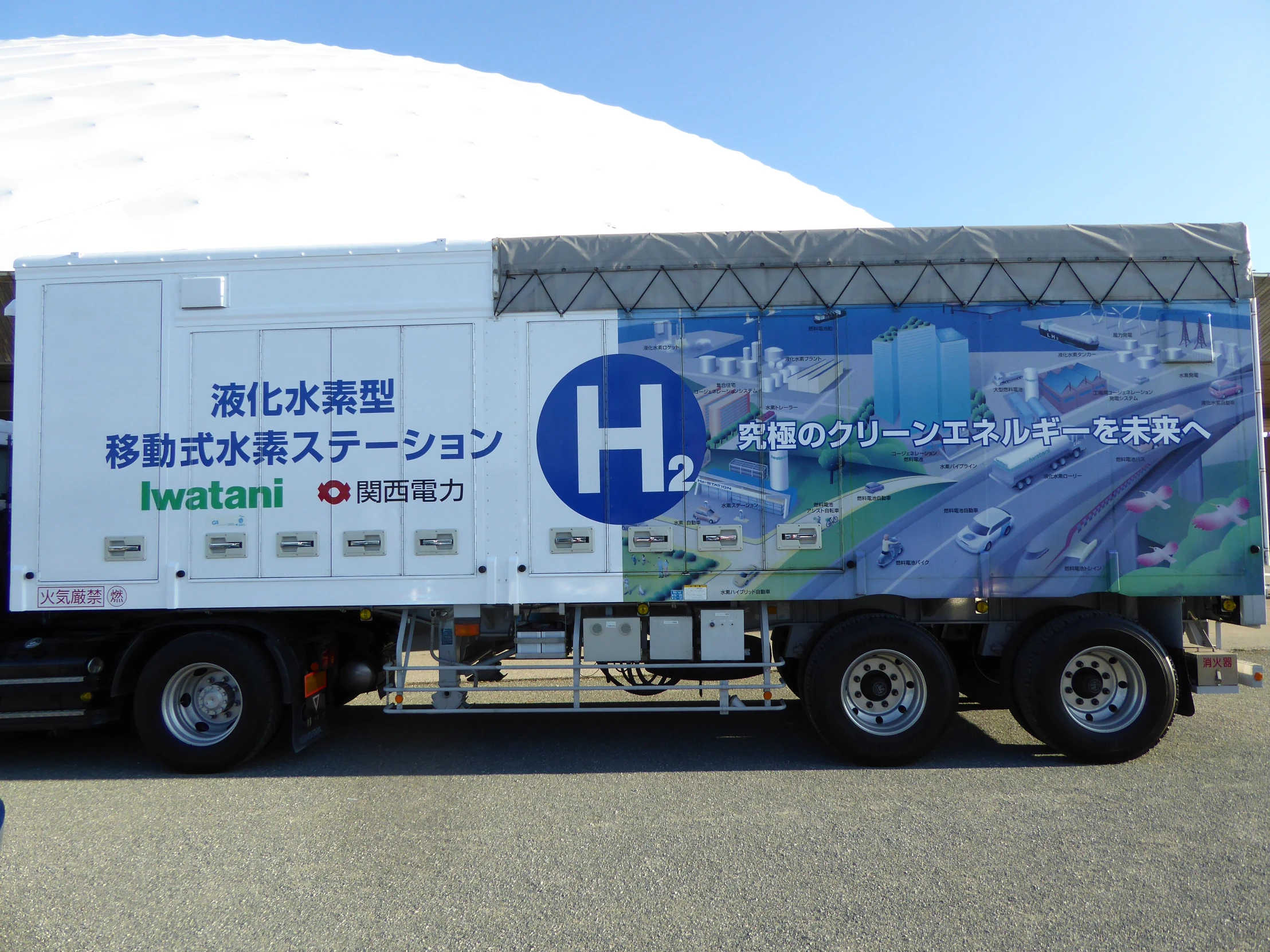 a semi truck that has a huge sign on the back