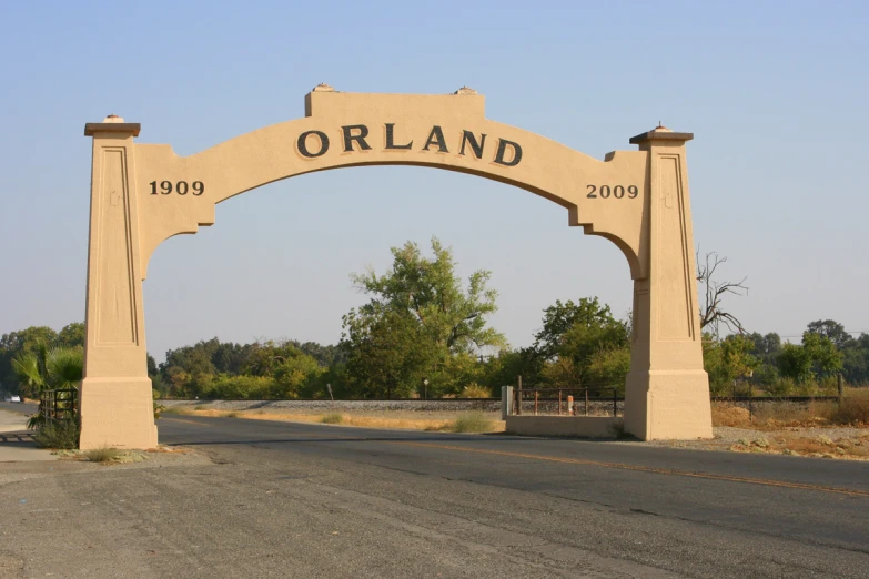 a archway that is on the side of the road