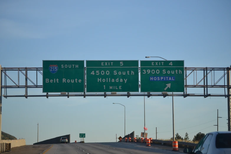 a highway sign above a freeway with the words east 5 exit 4 left 4