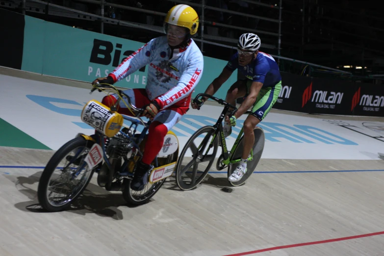 a couple of people on bicycles are on a court