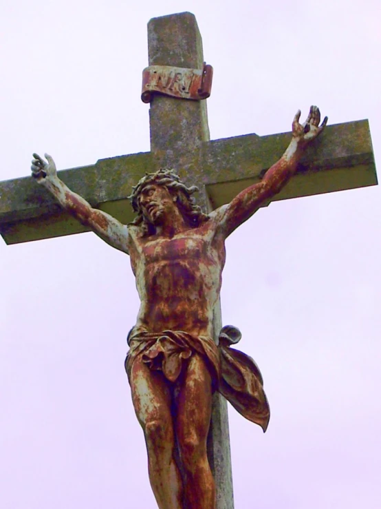 a picture of a jesus statue on a cross