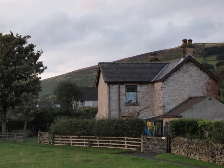 house with white walls and a brown roof