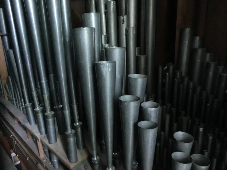 large group of gray pipes in the air