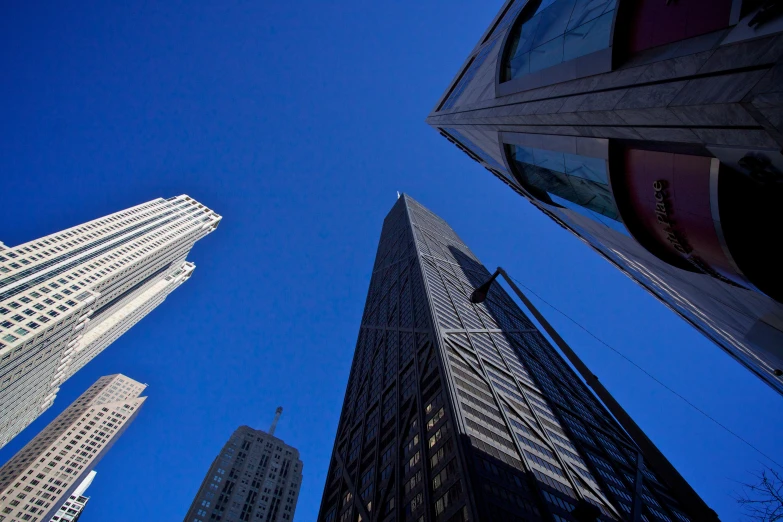 looking up at the tops of several buildings