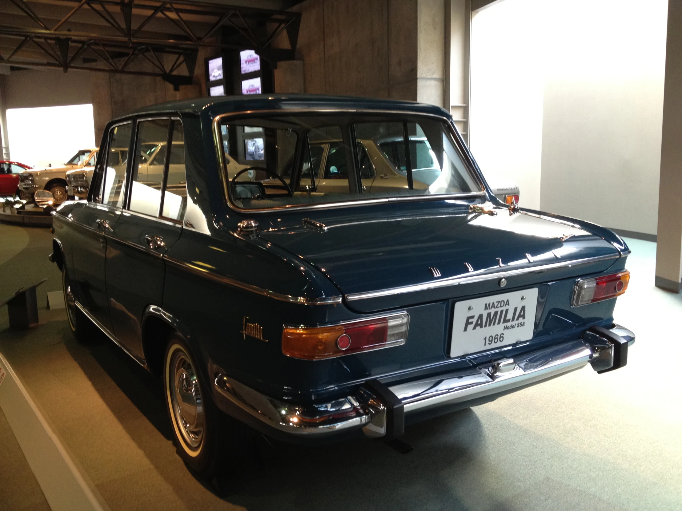 an old fashion automobile on display in a building