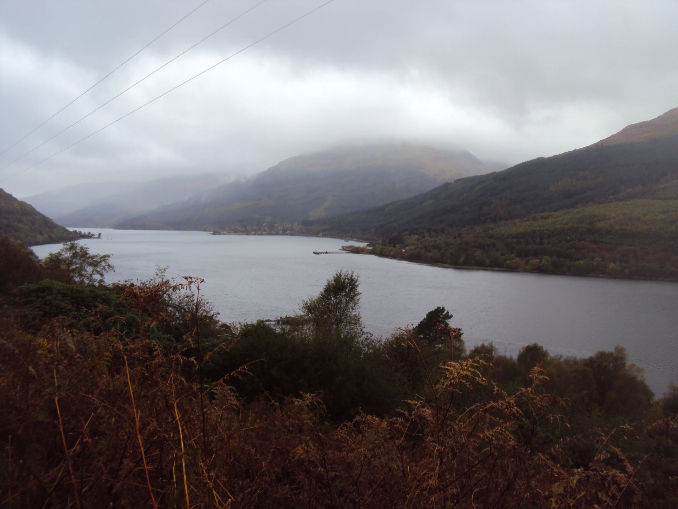 a body of water in the middle of a hilly area