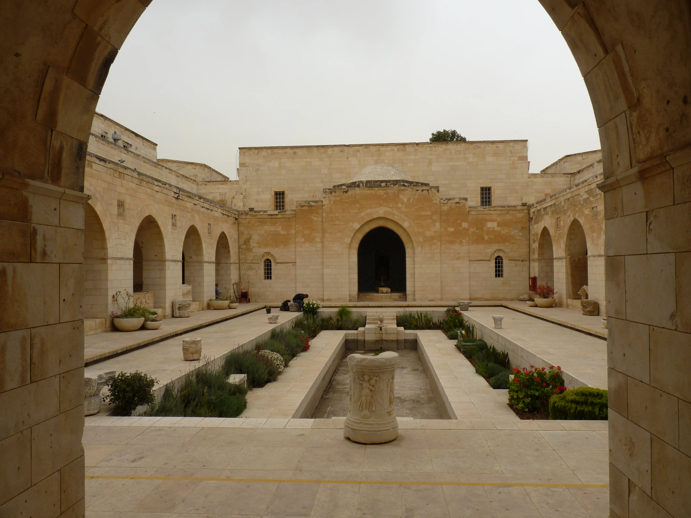 a small square with a fountain in the center