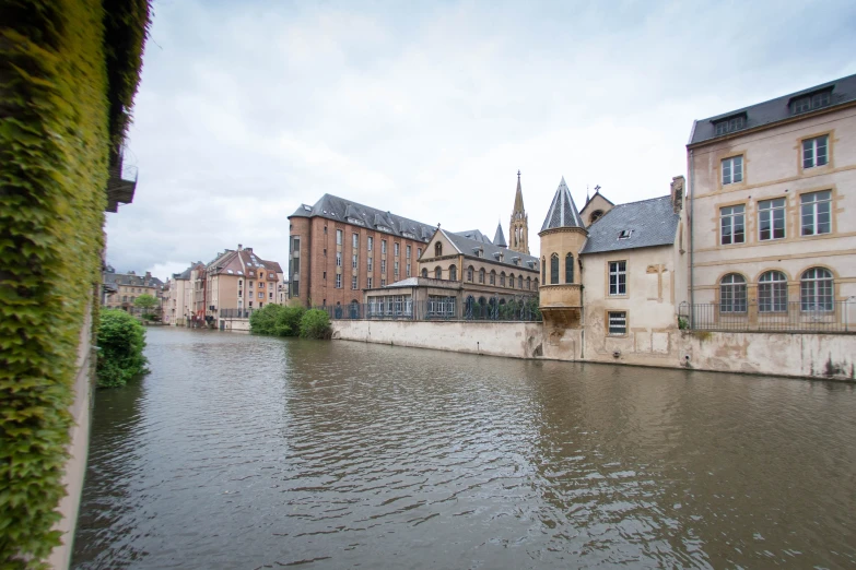 an old castle like building next to a canal