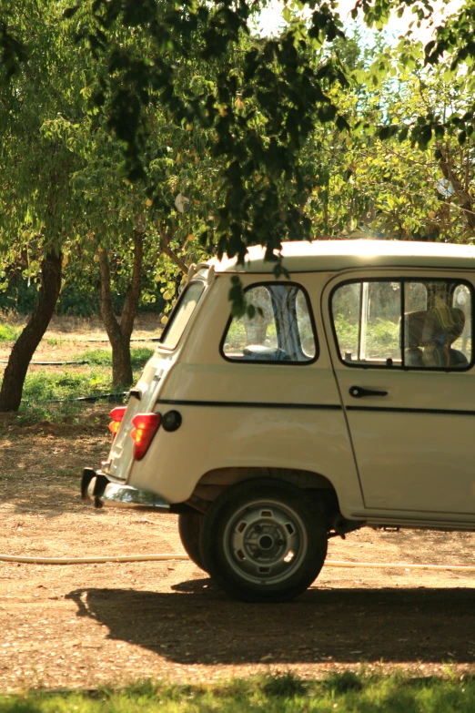 a small vehicle sitting on top of a dirt road