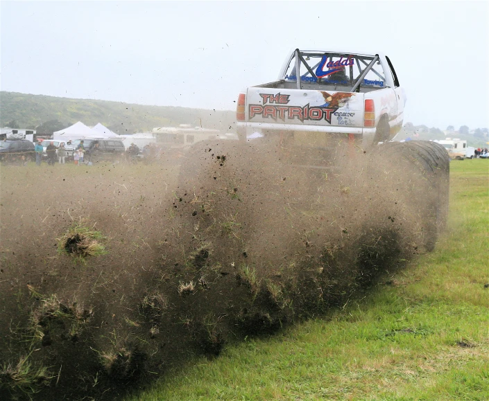 a truck on the road near a field