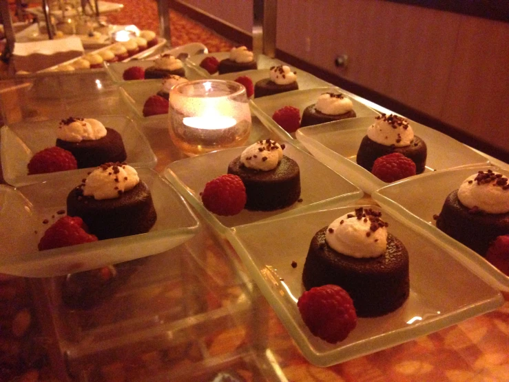 small plated desserts are on display in a buffet