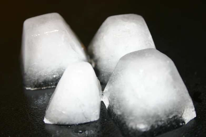 some pieces of ice sit on a table