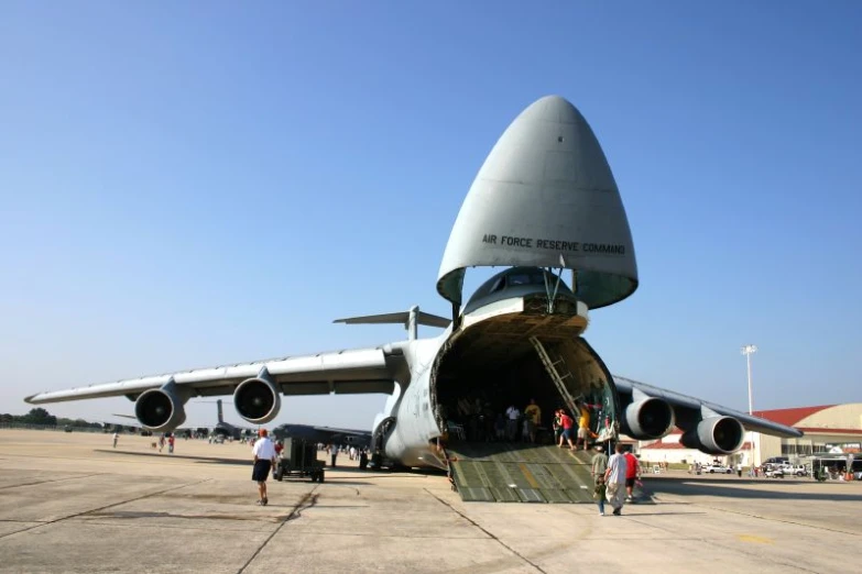 a large propeller jet sitting on top of an airport tarmac