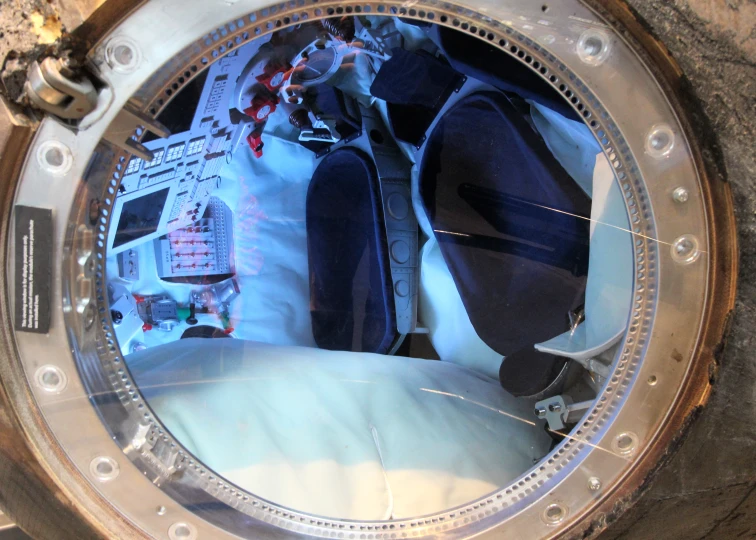 the interior of an automatic clock is seen through glass