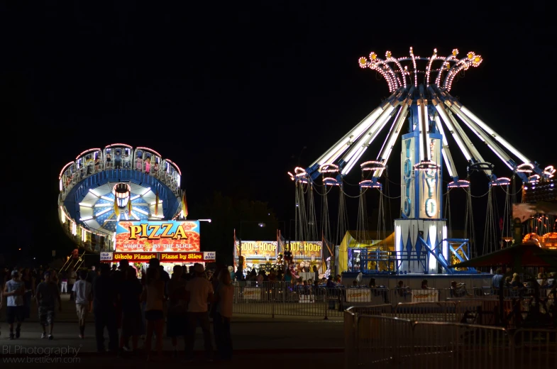 the people are getting ready to ride the merry - go - round