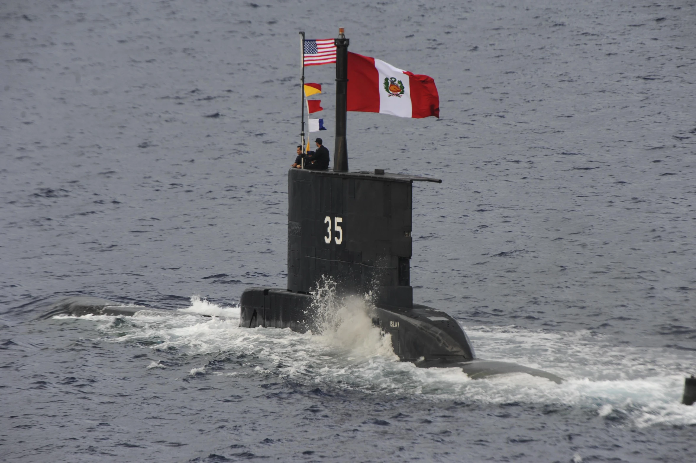 the two flags are flying from the side of a small ship