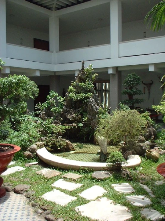 this patio has potted plants on each side