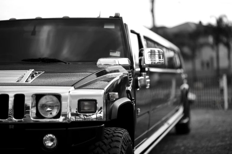 a black truck parked next to a road