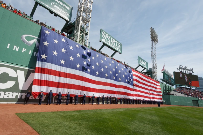 an american flag dd in the dugout during a baseball game